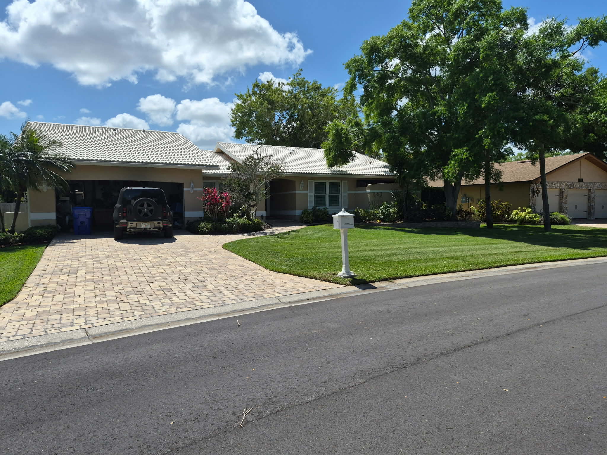 Beautifully maintained front yard with clean lawn