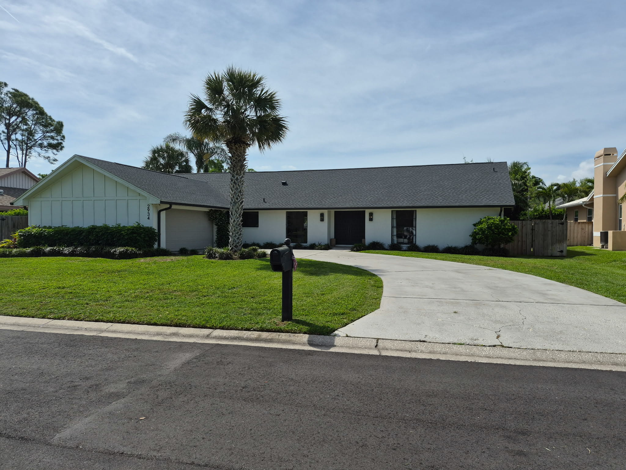 Neat residential lawn with clean edging and palm tree